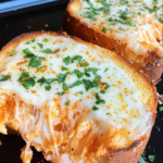 Soft Dinner Rolls Topped with Garlic and Herb Butter and Grated Parmesan